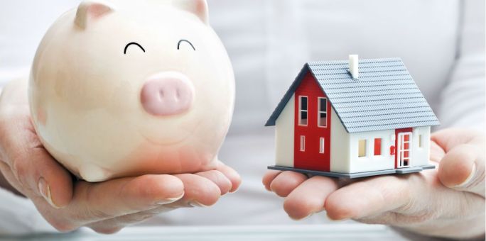 hands-holding-piggy-bank-and-house_iStock_2